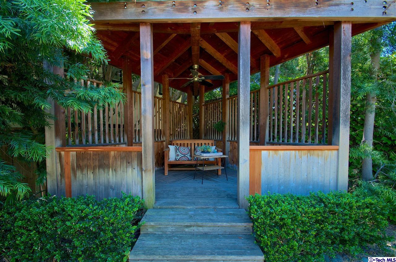 895 South Madison Avenue Pasadena, CA 91106 - Photo 33 of 38 a view of a porch with furniture and wooden floor