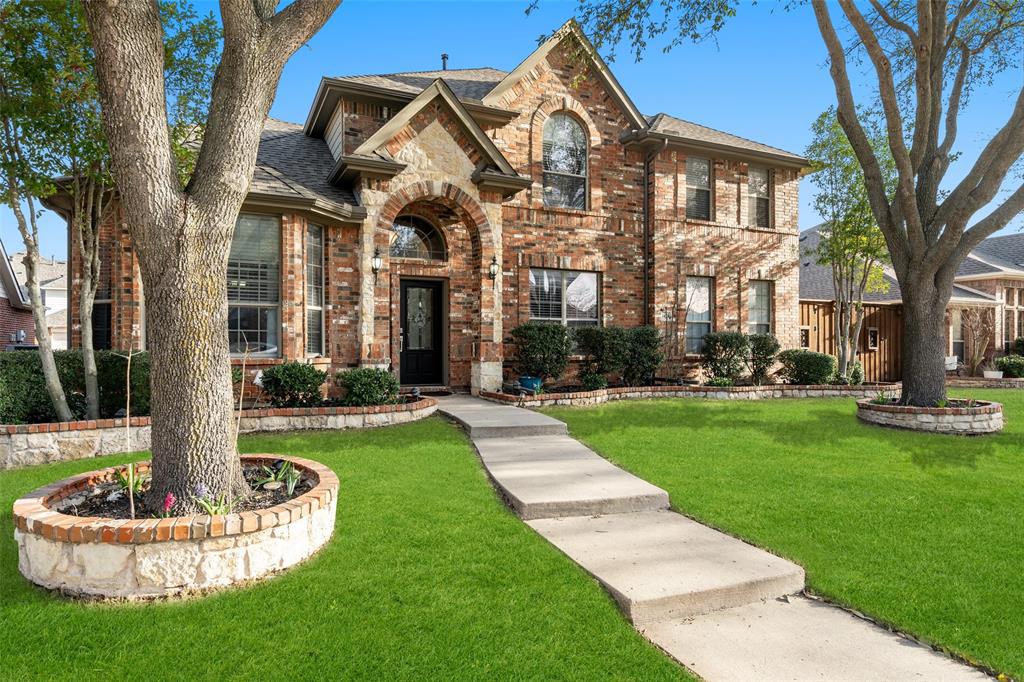 1435 Timber Ridge Drive Allen, TX 75002 - Photo 1 of 1 a front view of a house with a yard