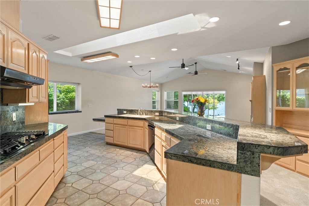 43 Edgewater Court Chico, CA 95928 - Photo 20 of 59 a large kitchen with stainless steel appliances granite countertop a stove and a sink