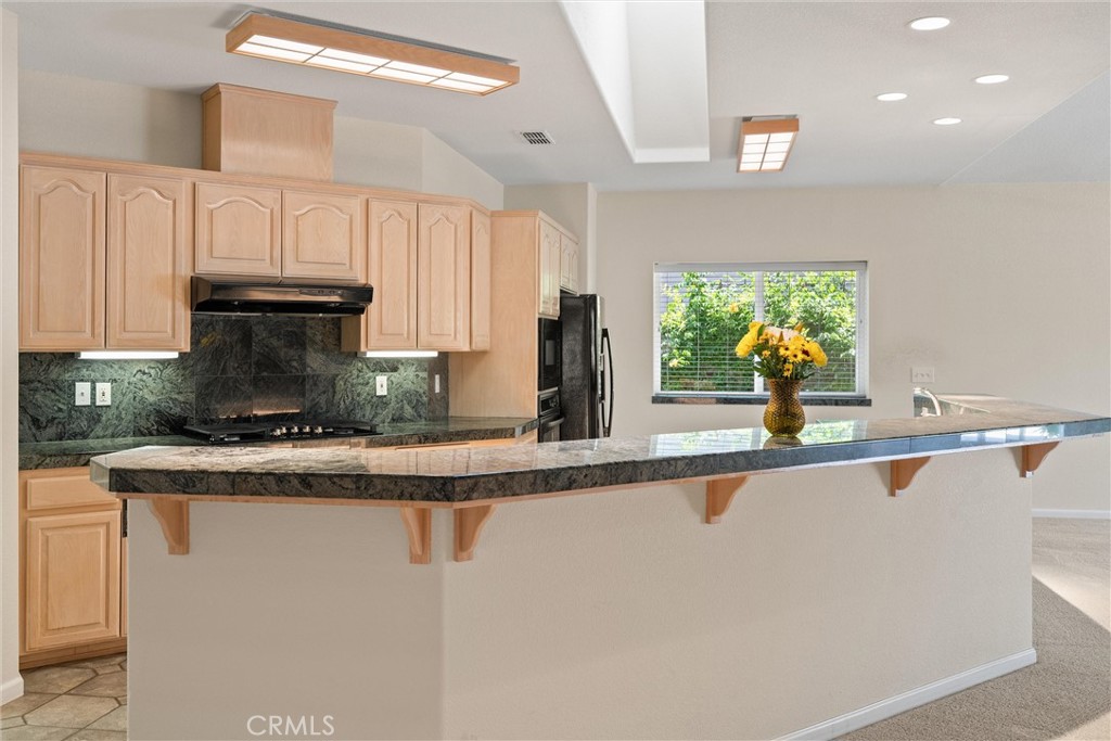43 Edgewater Court Chico, CA 95928 - Photo 21 of 59 a kitchen with stainless steel appliances granite countertop a sink and a stove