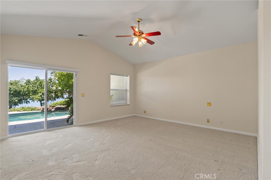 43 Edgewater Court Chico, CA 95928 - Photo 23 of 59 an empty room with windows and chandelier fan
