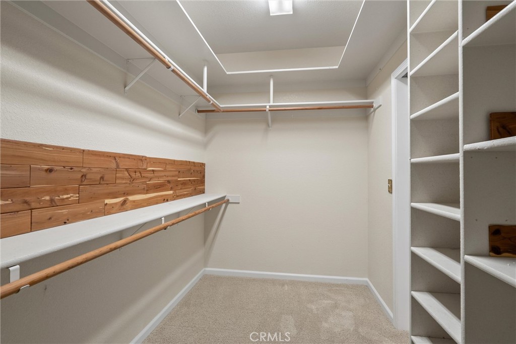 43 Edgewater Court Chico, CA 95928 - Photo 30 of 59 a view of walk in closet with clothes and shoes