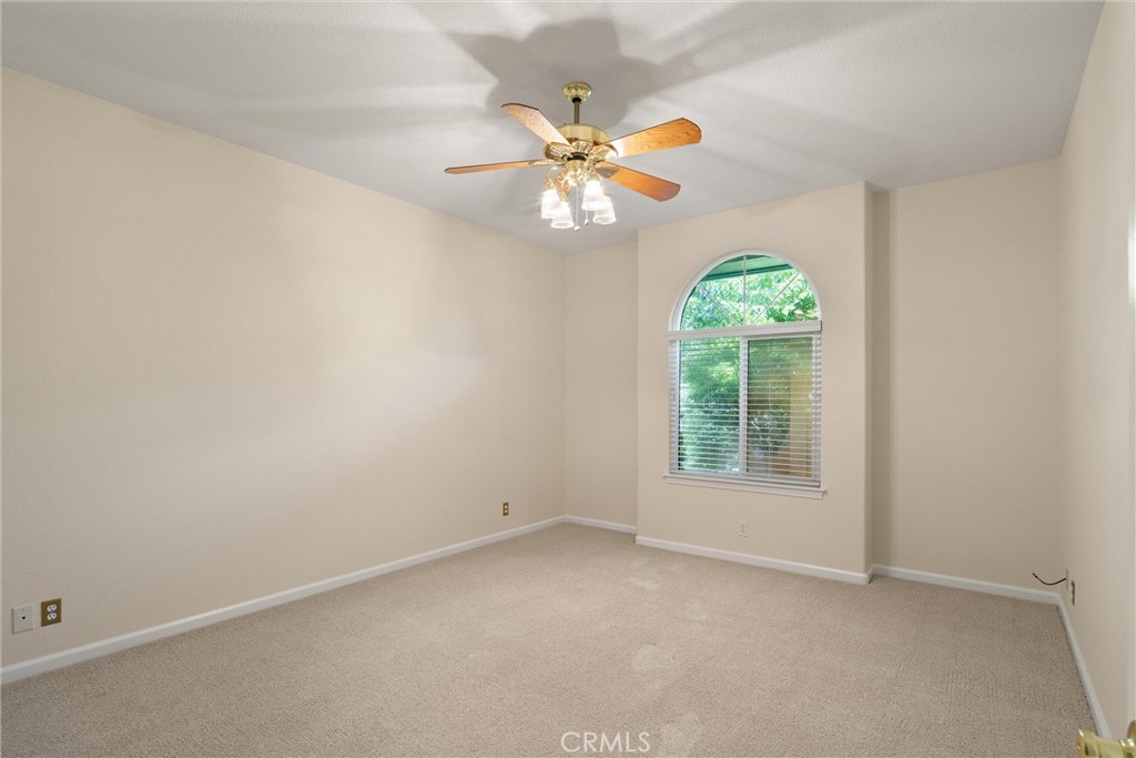 43 Edgewater Court Chico, CA 95928 - Photo 38 of 59 an empty room with a window and a chandelier