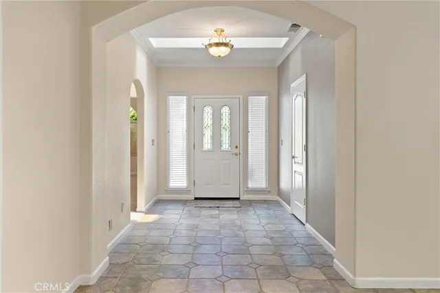 a view of a livingroom with a ceiling fan and window