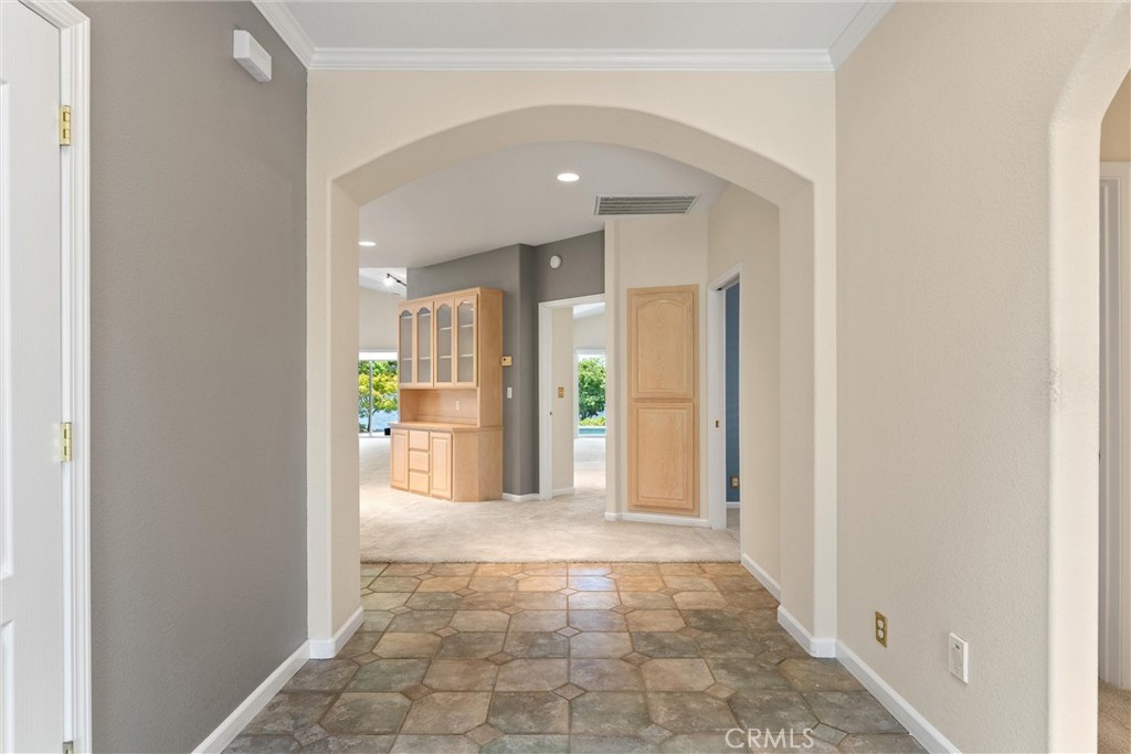 43 Edgewater Court Chico, CA 95928 - Photo 7 of 59 a view of a hallway with a dining table & chairs