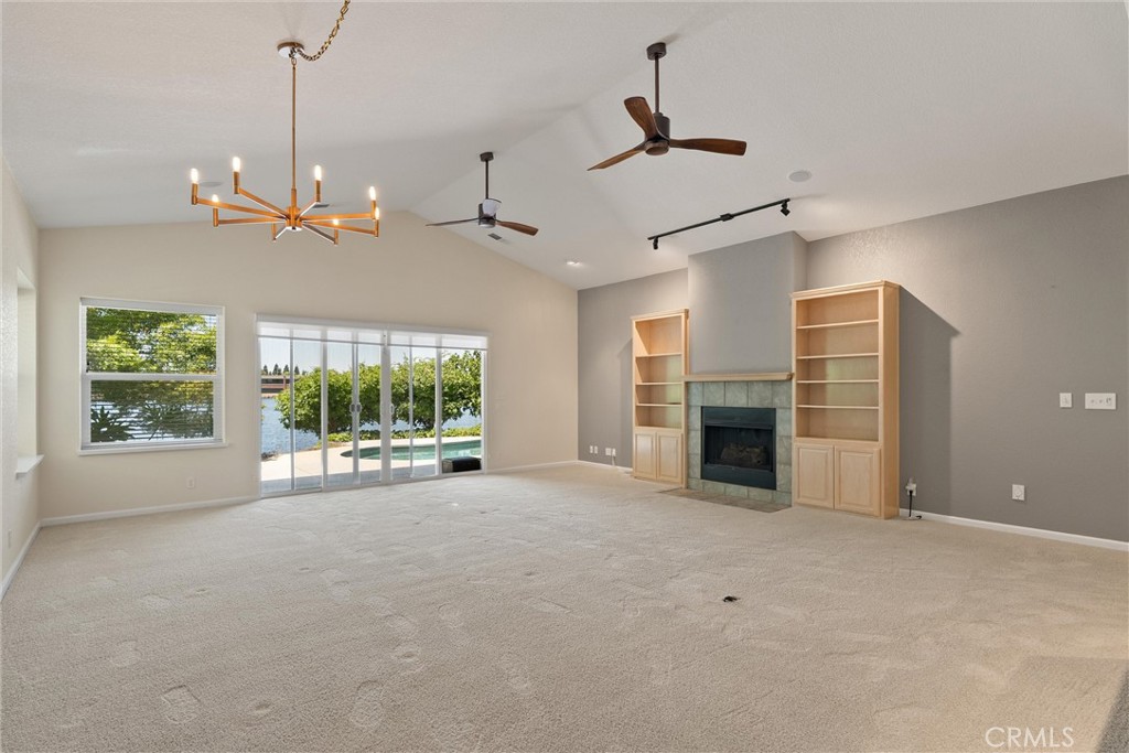 43 Edgewater Court Chico, CA 95928 - Photo 10 of 59 a view of an empty room with a window and kitchen view