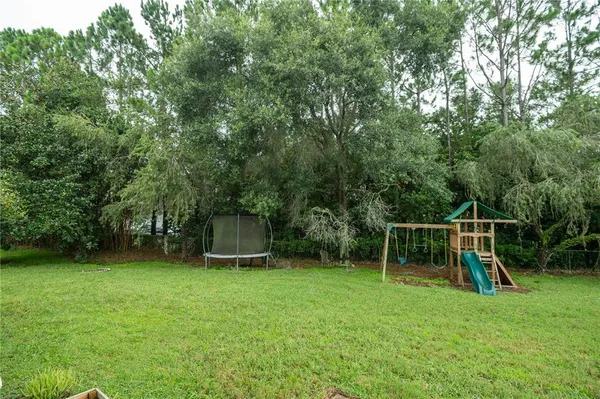a view of a backyard with a slide