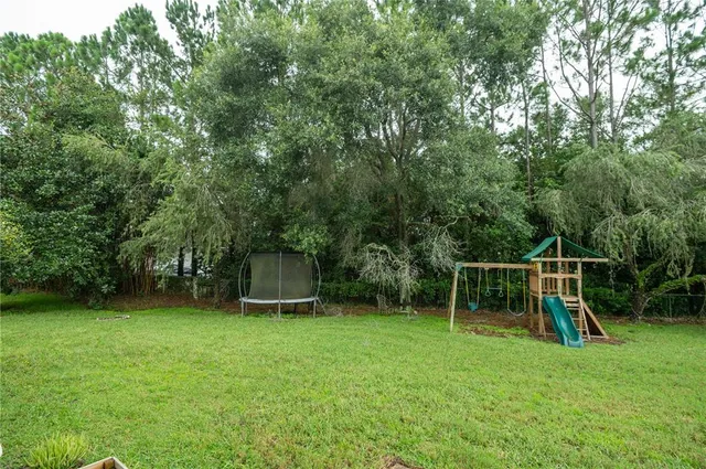 a view of a backyard with a slide
