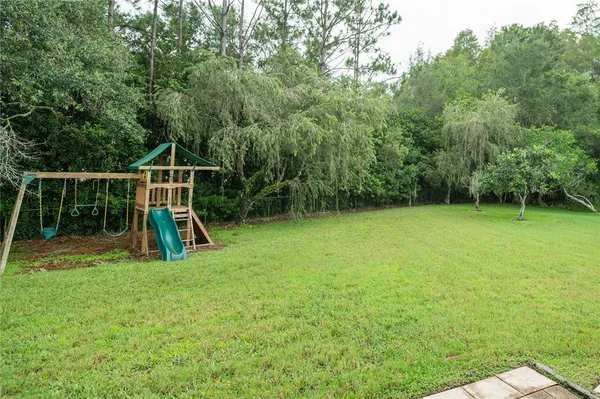 a view of a yard with a slide