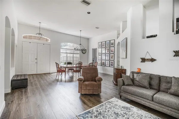 a living room with furniture and a table
