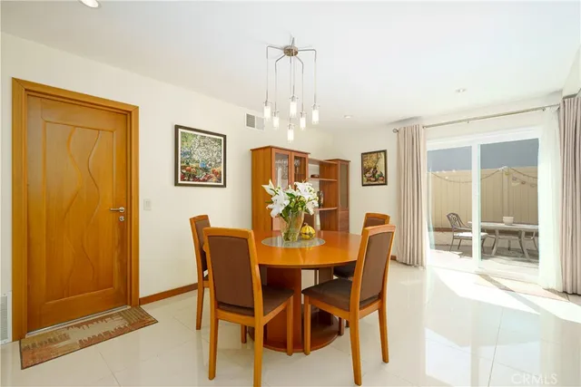 a living room with hard wood floor and a window