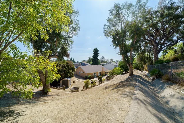 a view of a backyard of the house