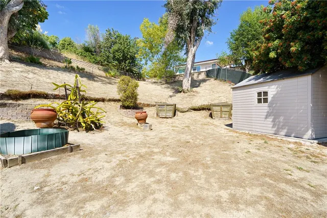 a view of a house with snow on the road