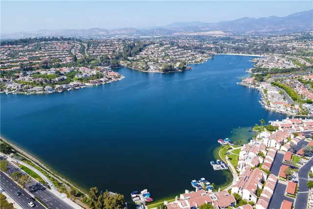 an aerial view of a city with ocean view