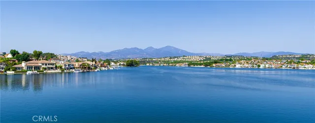 a view of an ocean and a mountain