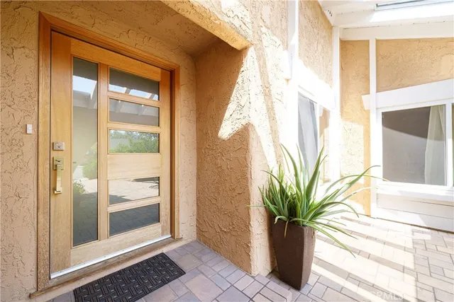 a kitchen with stainless steel appliances a refrigerator and a stove top oven