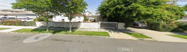 a view of a house with swimming pool and a yard