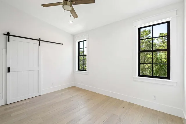 a view of an empty room with a window