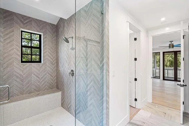 a bathroom with a bathtub and shower