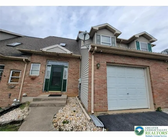 front view of a house with a small yard