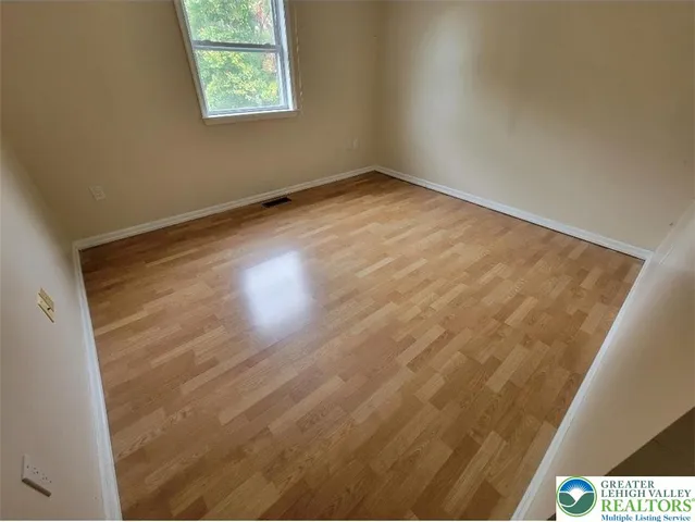 an empty room with a fireplace