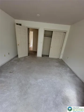 a view of bedroom with wooden floor
