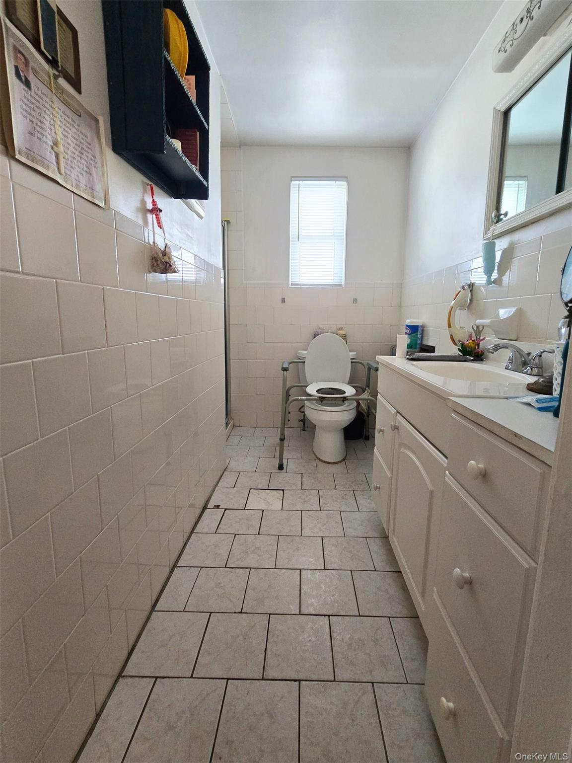 27 Midwood Street Hempstead, NY 11550 - Photo 12 of 13 a bathroom with a sink toilet and shower