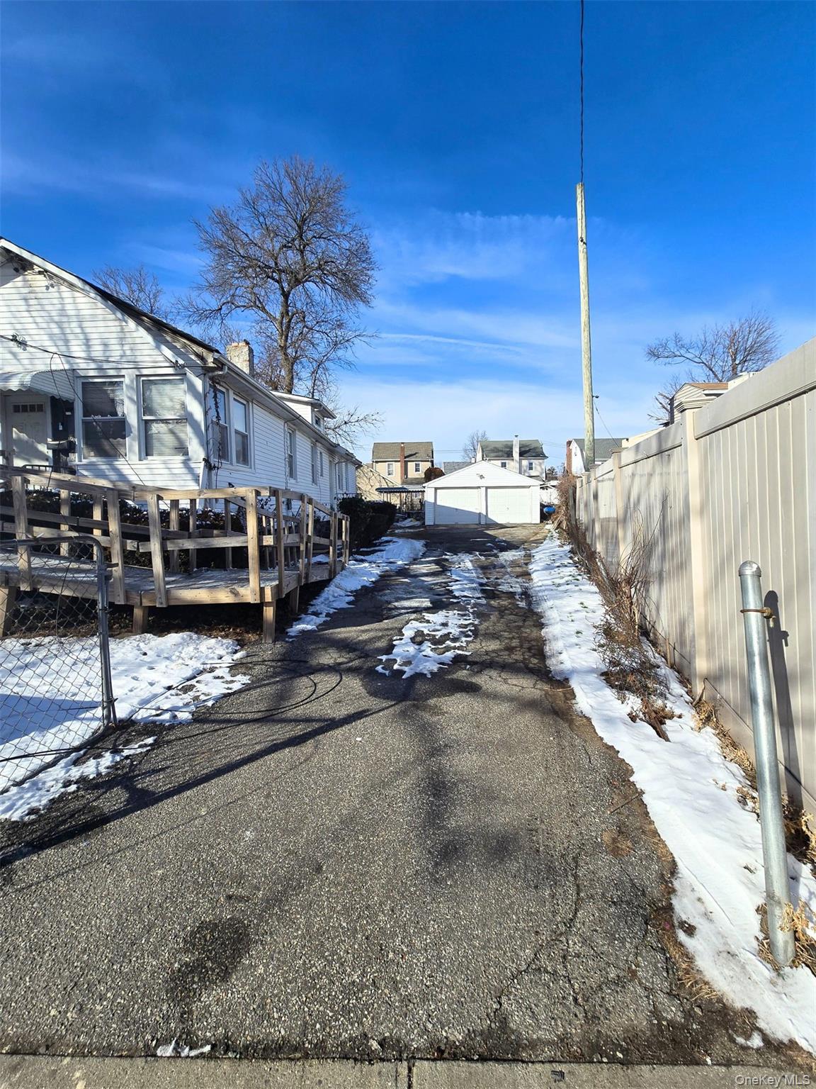 27 Midwood Street Hempstead, NY 11550 - Photo 2 of 13 a view of a house with a road