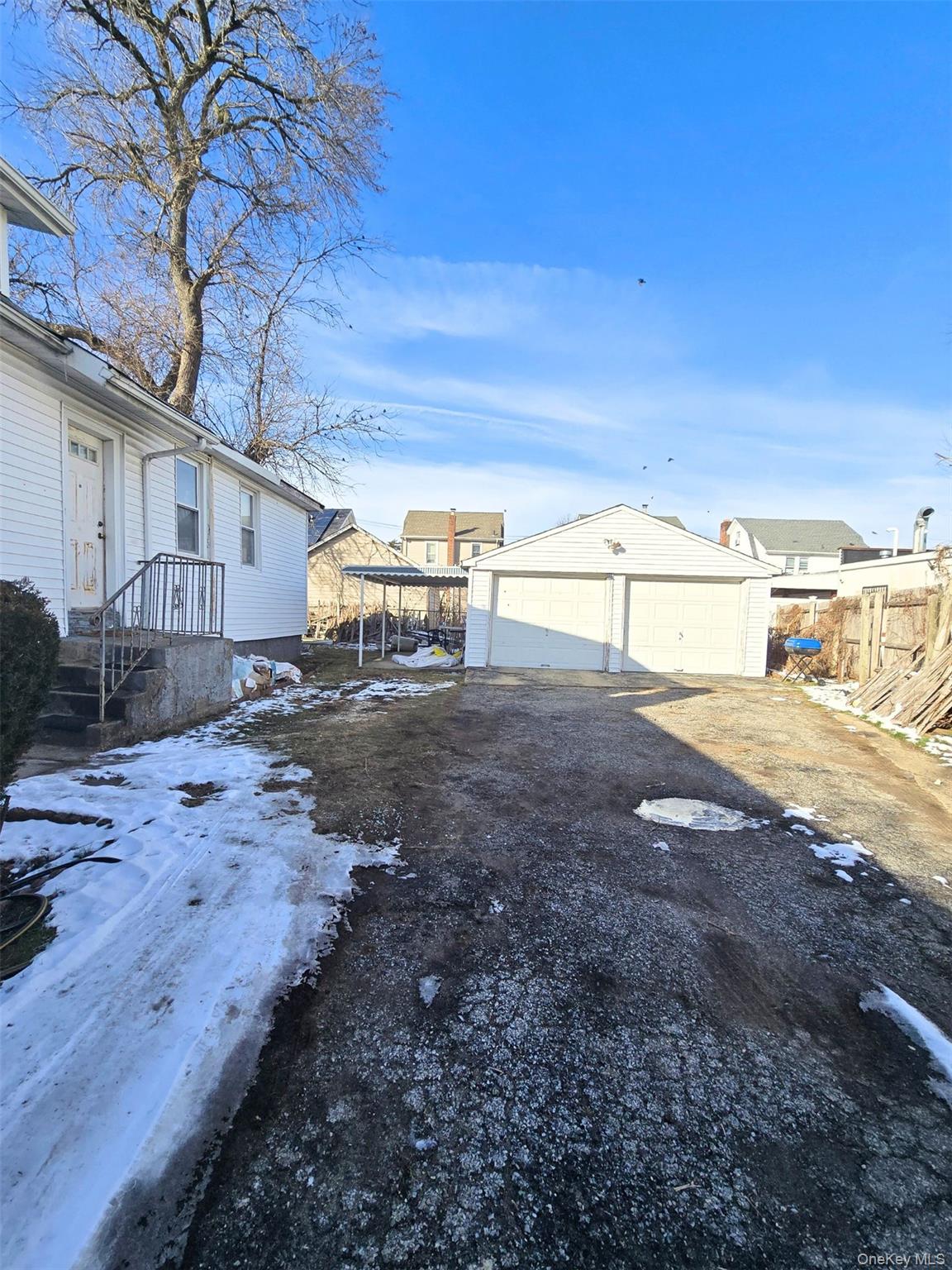 27 Midwood Street Hempstead, NY 11550 - Photo 3 of 13 a view of a backyard of the house