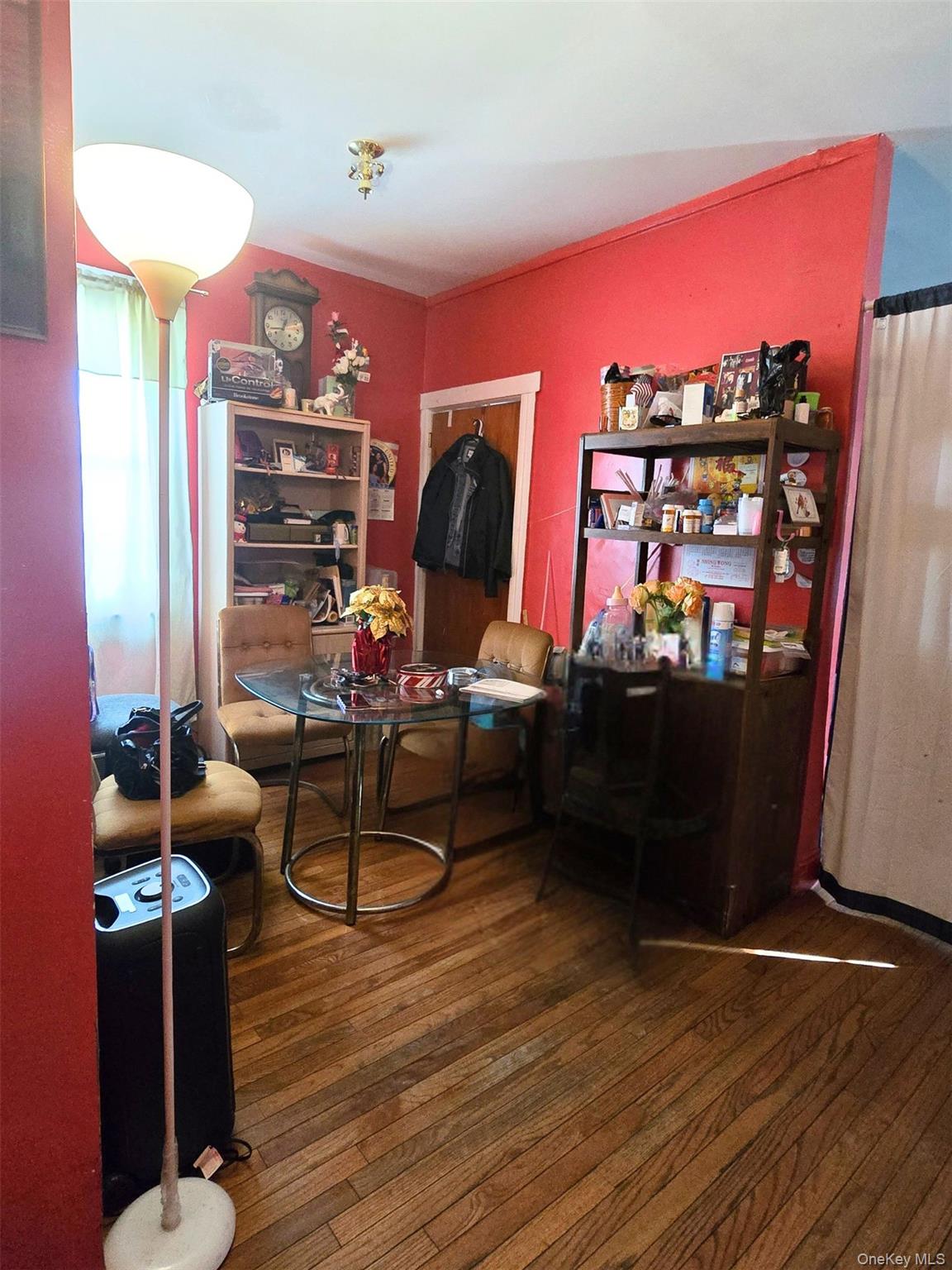 27 Midwood Street Hempstead, NY 11550 - Photo 8 of 13 a room with furniture and wooden floor
