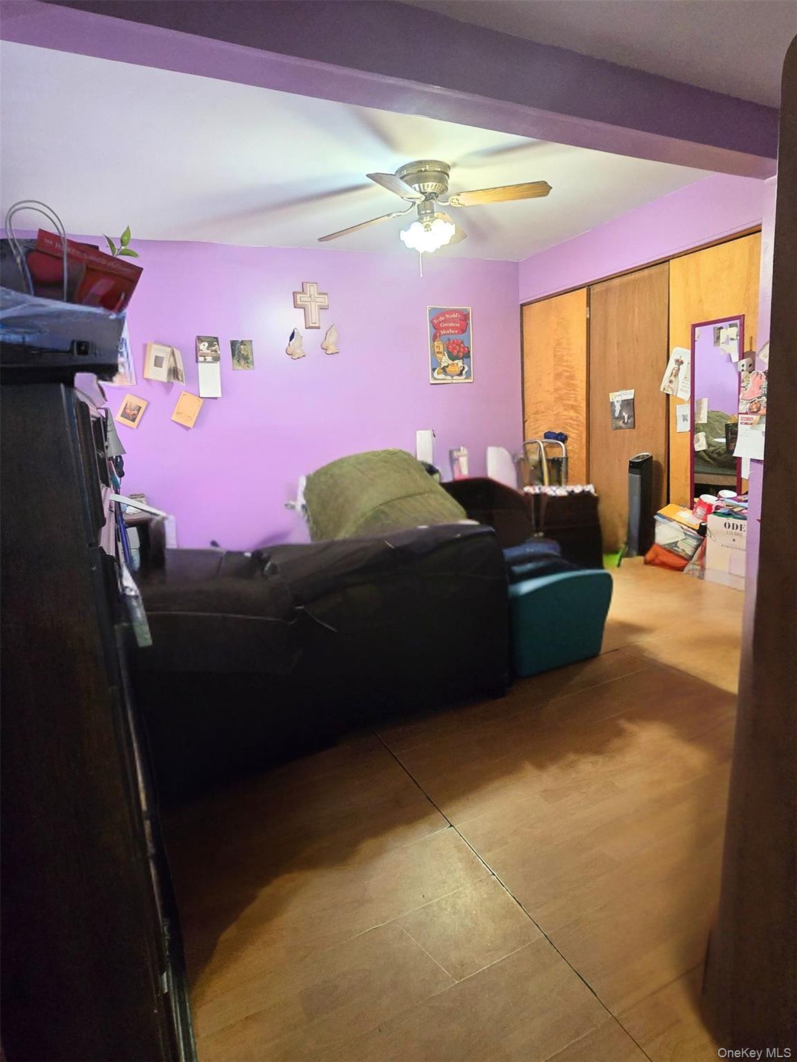 27 Midwood Street Hempstead, NY 11550 - Photo 9 of 13 a bedroom with furniture and a bed