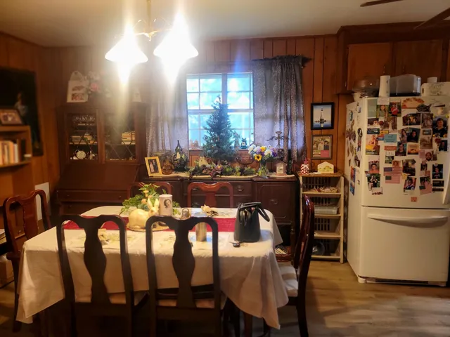 a dining room with furniture and window