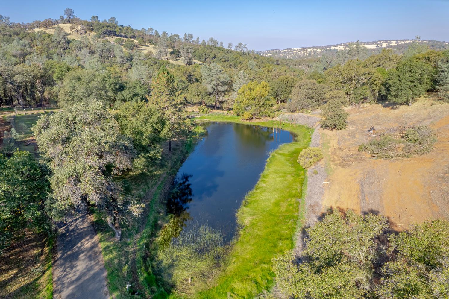 5585 Garden Bar Road Lincoln, CA 95648 - Photo 4 of 26 a view of a lake with a mountain in the background