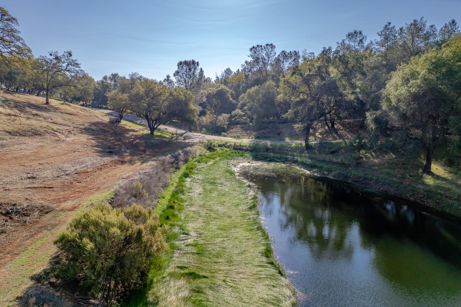 5585 Garden Bar Road Lincoln, CA 95648 - Photo 7 of 26 a view of a lake with trees by side of it