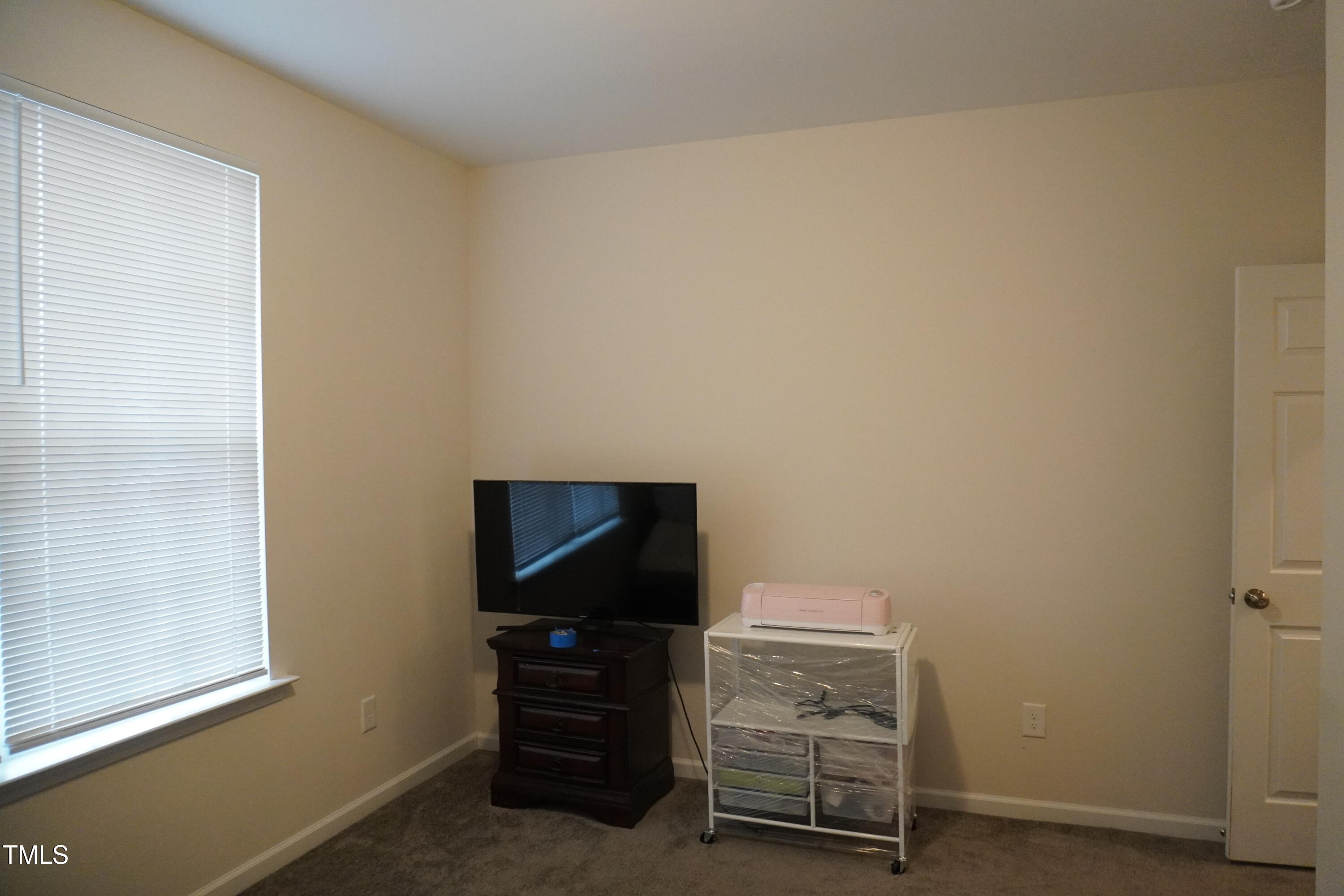 1850 Gillburg Road Henderson, NC 27537 - Photo 20 of 31 a room with furniture and a flat screen tv