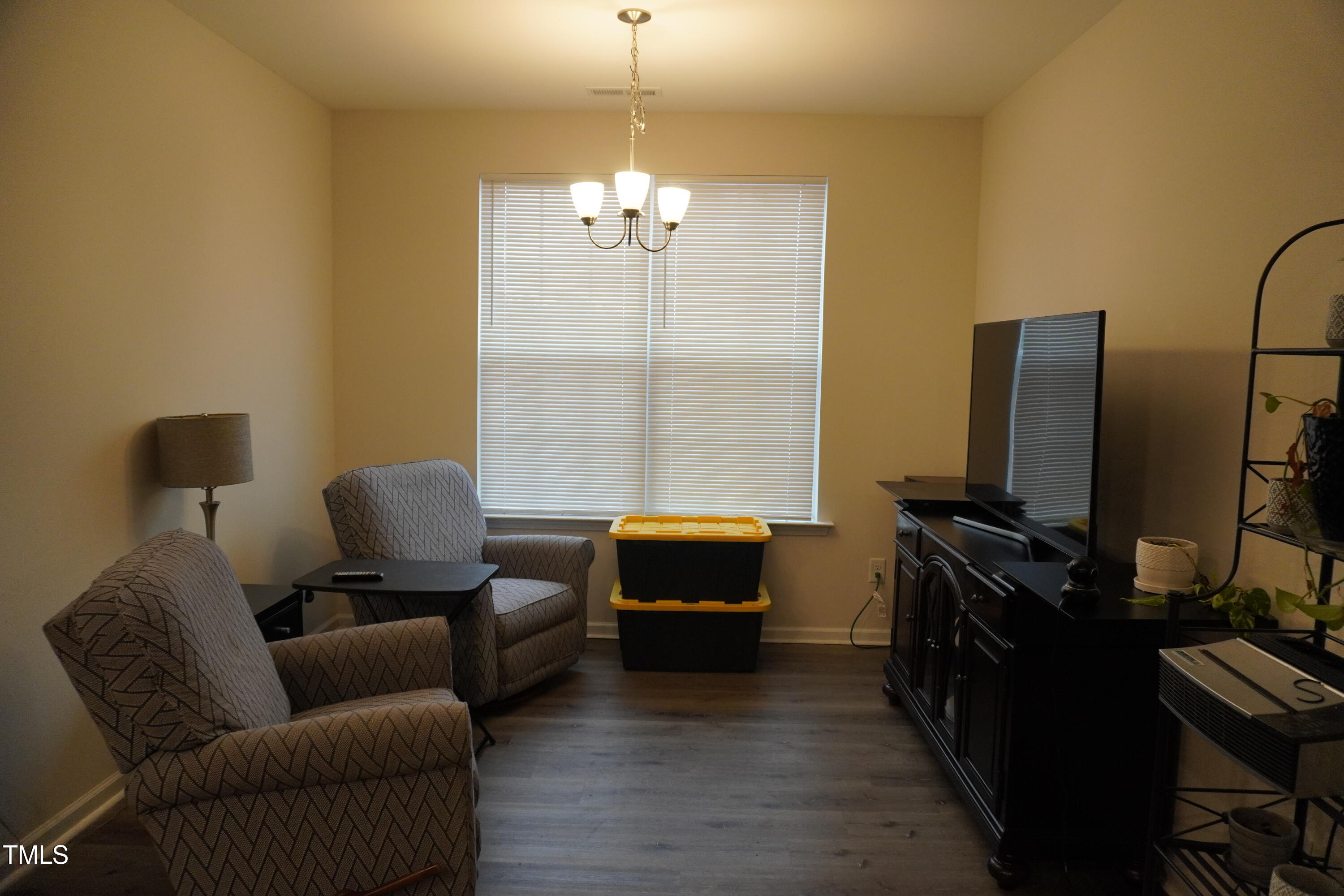 1850 Gillburg Road Henderson, NC 27537 - Photo 23 of 31 a living room with furniture and a flat screen tv