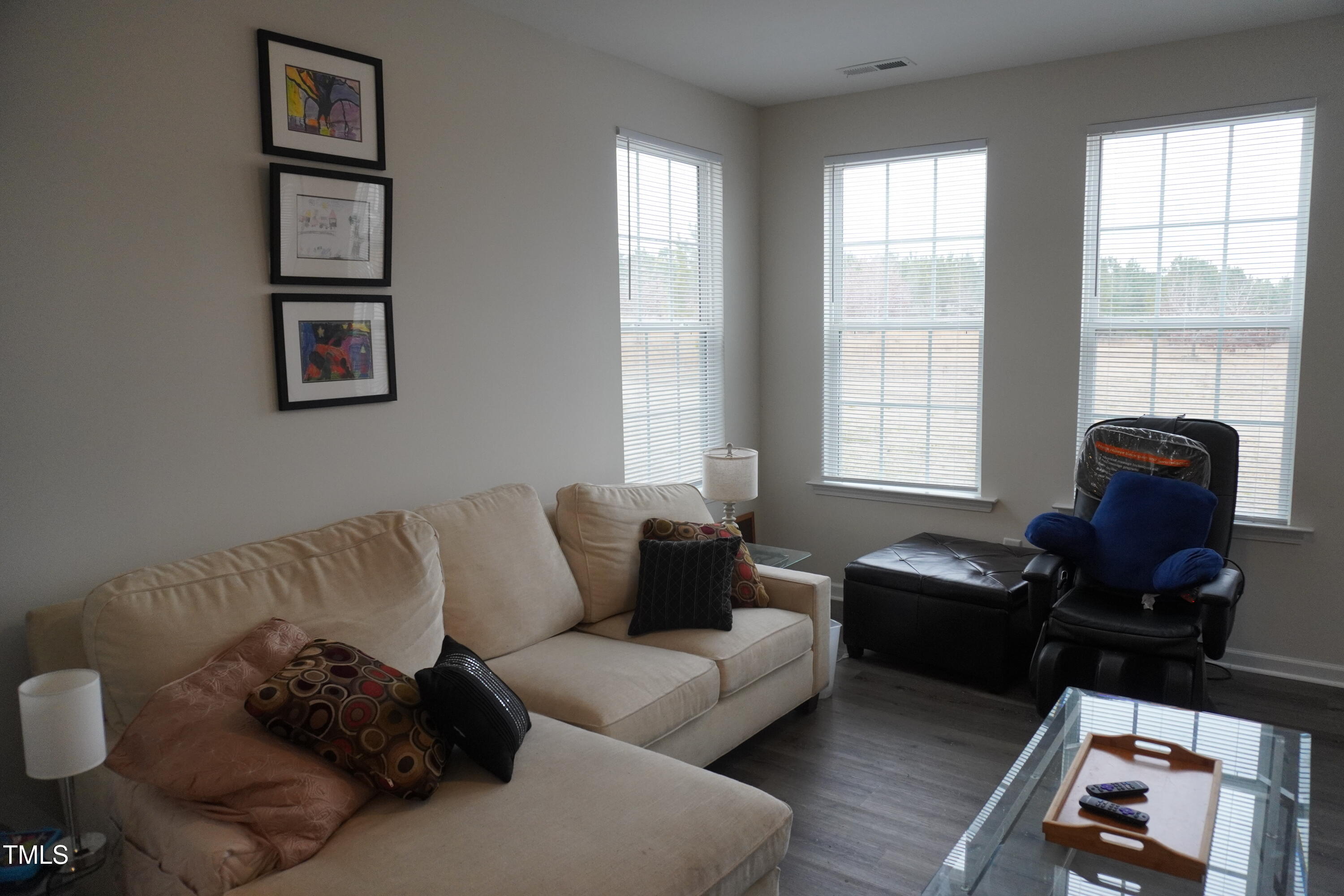 1850 Gillburg Road Henderson, NC 27537 - Photo 27 of 31 a living room with furniture and a window