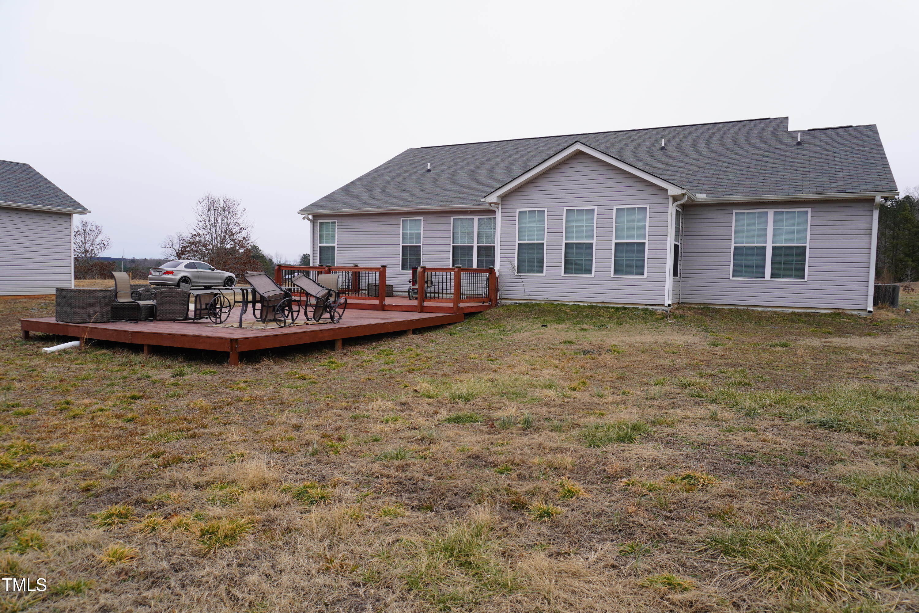 1850 Gillburg Road Henderson, NC 27537 - Photo 7 of 31 a front view of a house with a garden and yard