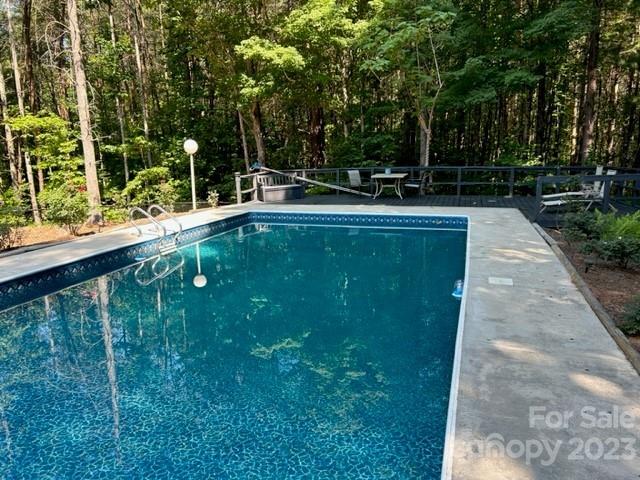 2955 Alpine Lane Morganton, NC 28655 - Photo 12 of 48 a view of a swimming pool with a patio