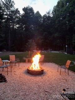 2955 Alpine Lane Morganton, NC 28655 - Photo 14 of 48 a view of a yard with a fire pit and outdoor seating