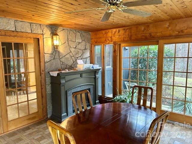 2955 Alpine Lane Morganton, NC 28655 - Photo 19 of 48 a living room with fireplace furniture and a floor to ceiling window