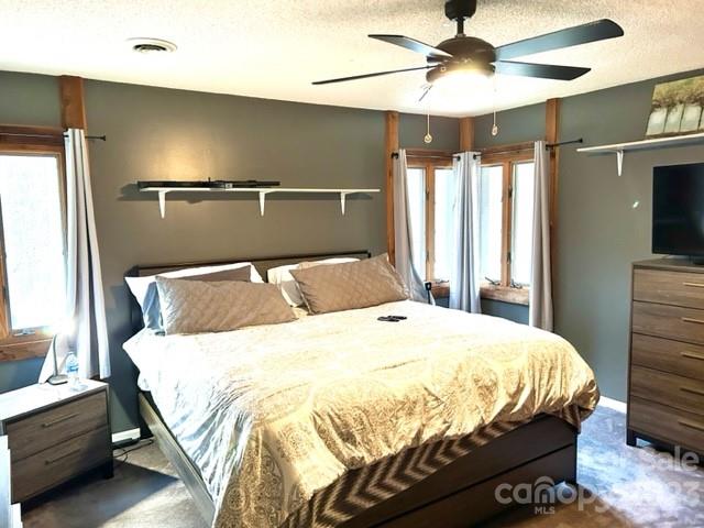 2955 Alpine Lane Morganton, NC 28655 - Photo 32 of 48 a bedroom with a bed and a chandelier