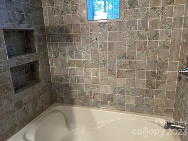 2955 Alpine Lane Morganton, NC 28655 - Photo 36 of 48 a bathroom with a shower and a bath tub