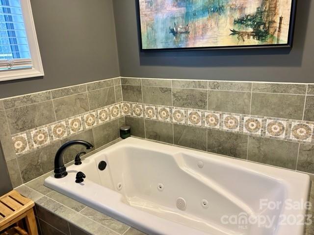2955 Alpine Lane Morganton, NC 28655 - Photo 37 of 48 a white bath tub sitting next to a sink