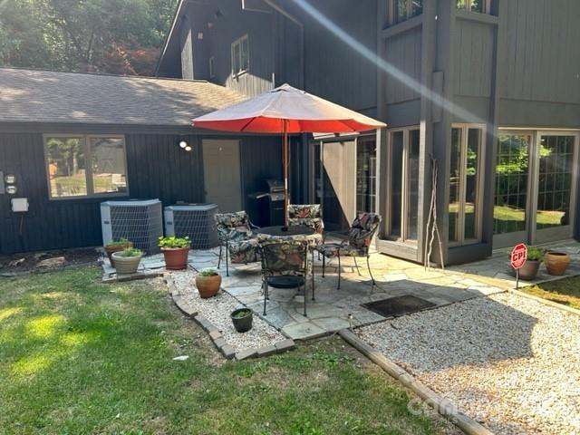 2955 Alpine Lane Morganton, NC 28655 - Photo 4 of 48 a view of a patio with table and chairs under an umbrella