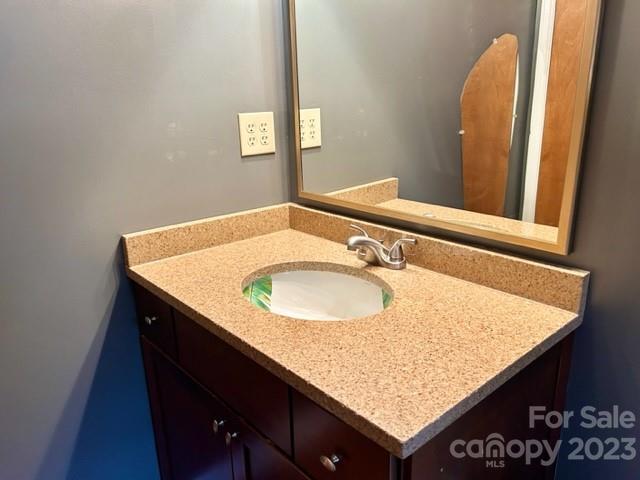 2955 Alpine Lane Morganton, NC 28655 - Photo 41 of 48 a bathroom with a granite countertop sink and a mirror