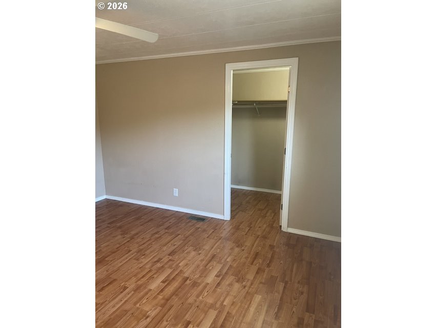 5660 Daisy Street, Unit 31 Springfield, OR 97478 - Photo 30 of 44 a view of an empty room with wooden floor