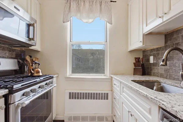 a kitchen with a stove and a sink