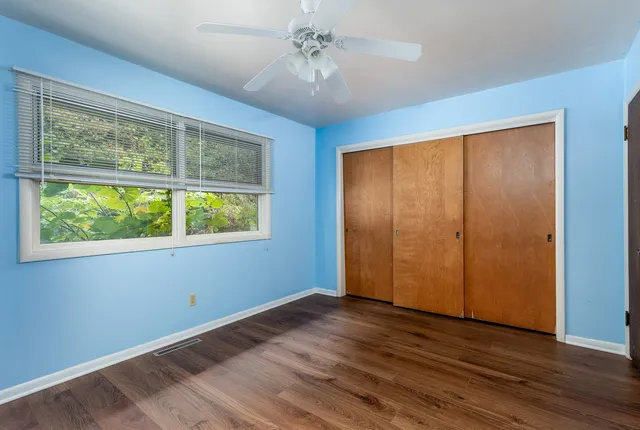 a view of room with window and ceiling fan