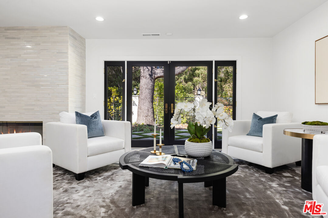 16167 Meadowcrest Road Sherman Oaks, CA 91403 - Photo 11 of 31 a living room with furniture and a large window